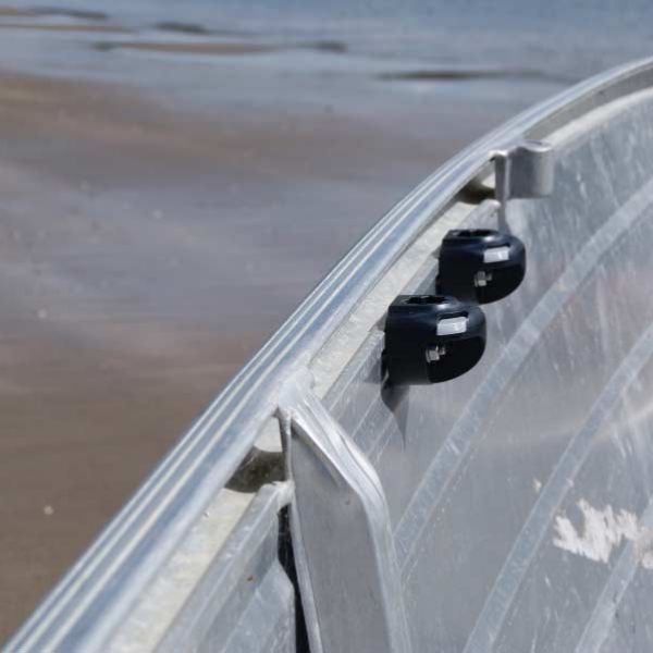 Sideports attached to gunwale of tinnie dinghy